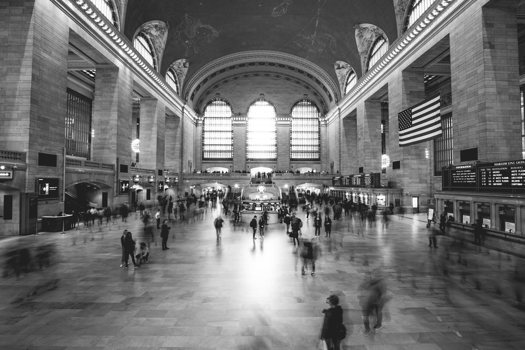 A group of people walking in front of Grand Central Terminal